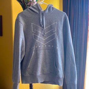 A grey sport tek hoodie, gender neutral in my opinion. Warm and a bit oversized.